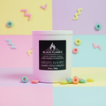 Black Flamez Fruity Loopz candle in a pastel retro cereal-inspired setting with colorful loops